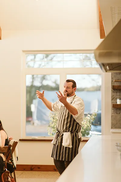chef teaching class inside restored barn